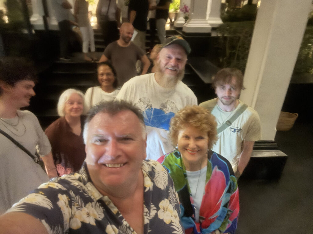 Andy Shaw taking a group selfie with friends